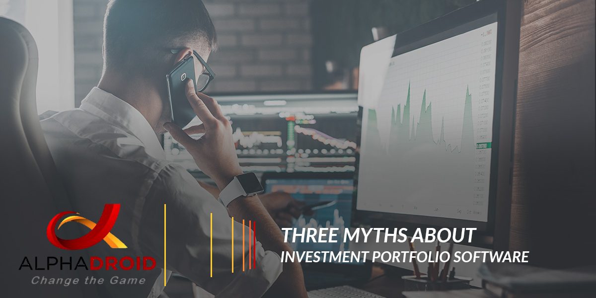 man on phone looking at multiple screens